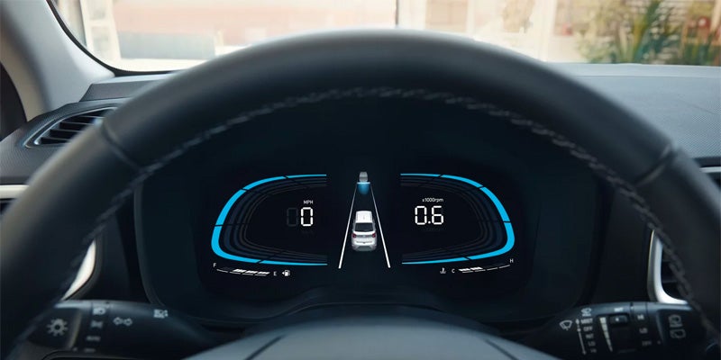 Close-up of a car's digital dashboard showing the lane keeping assist feature.